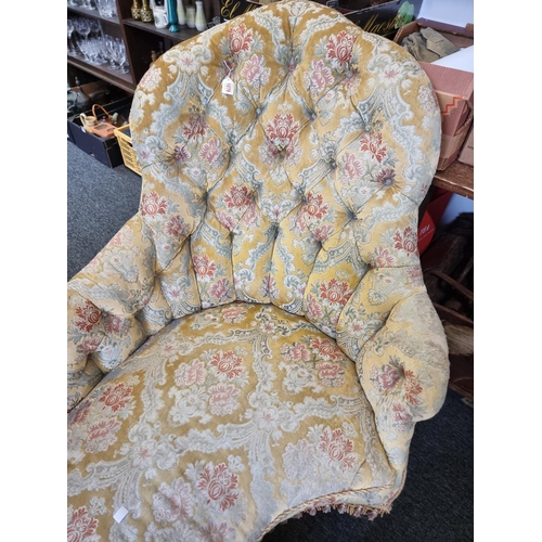 1079 - A Victorian button upholstered chaise longue, of shaped outline, approx 180cm wide.