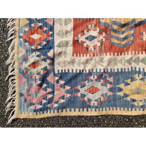 1140 - A Kelim flatweave rug, 194 x 113cm.