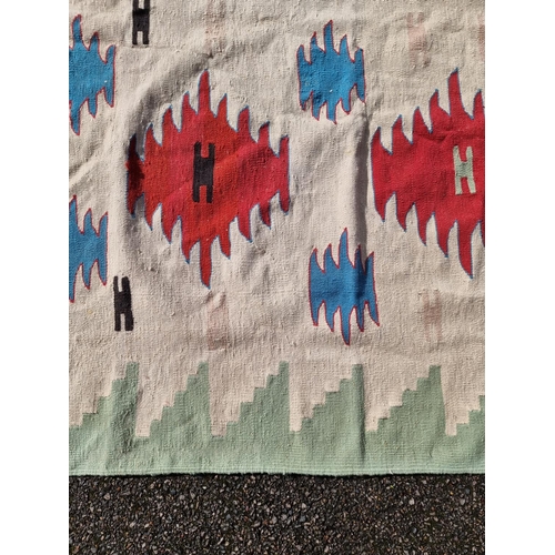 1143 - A Tribal flatweave rug, 177 x 115cm.