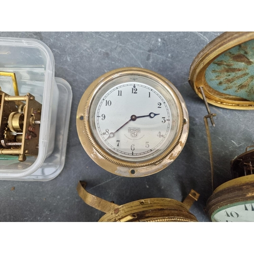 1781 - A mixed group of clocks and timepiece dials and movements, to include a Smiths car clock.... 