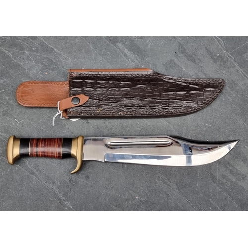 107 - A Down Under 'The Outback' knife and sheath, having 27.5cm blade.