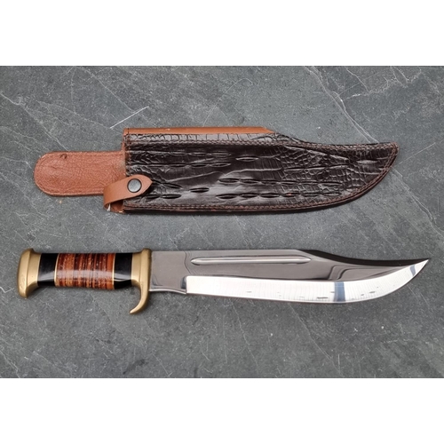 108 - A Down Under 'The Outback' knife and sheath, having 27.5cm blade.