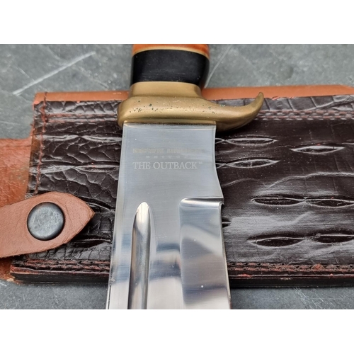 108 - A Down Under 'The Outback' knife and sheath, having 27.5cm blade.