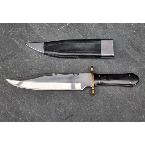 115 - A Henry 'Liberty or Death' Bowie knife and sheath, having buffalo horn handle and 24cm blade.... 