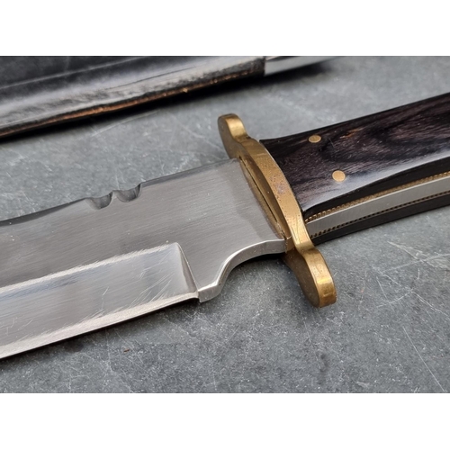 115 - A Henry 'Liberty or Death' Bowie knife and sheath, having buffalo horn handle and 24cm blade.... 