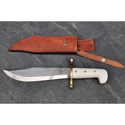 116 - A Case XX USA Bowie knife and sheath, having 24cm blade.