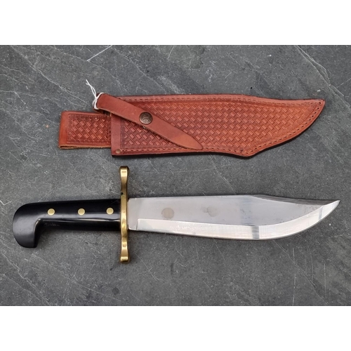 117 - A Case XX USA Bowie knife and sheath, having 24cm blade.