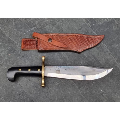 124 - A Case XX USA Bowie knife and sheath, having 24cm blade.