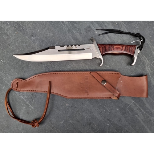 127 - A Hibben 'Mark 3' Bowie knife and sheath, having 27.5cm blade.