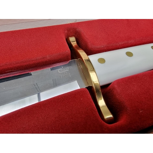 132 - A Case XX presentation 'CA2000' Bowie knife and sheath, having 24cm blade, boxed.