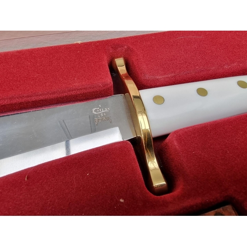 133 - A Case XX presentation 'CA311' Bowie knife and sheath, having 24cm blade, boxed.