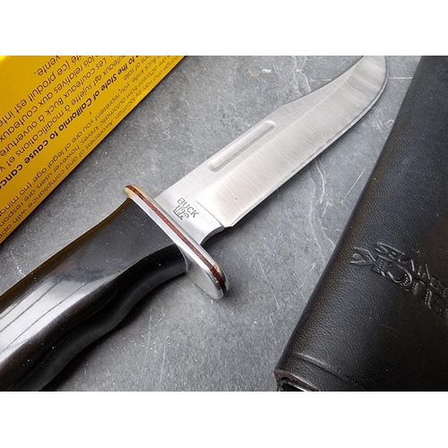 134 - A Buck 'Tops Knight Hawk 650' knife and sheath, having 15.8cm blade; together with a Buck '120' Bowi... 