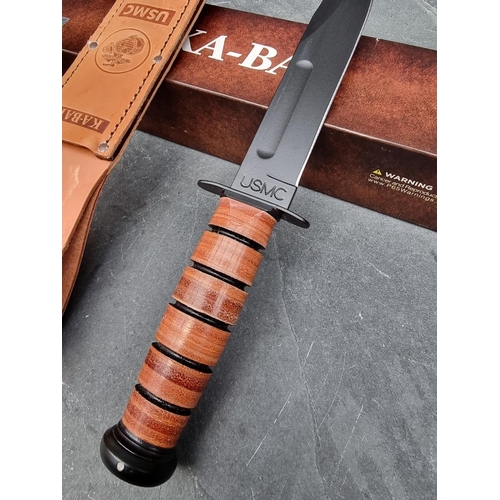 137 - A Ka-Bar '1217' USMC knife and sheath, having 18cm blade, boxed.