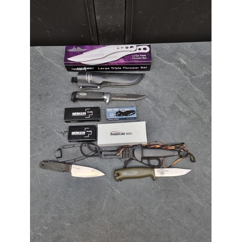 144 - A set of Hibben 'Large Triple Thrower GH455C' knives and sheaths, having 11cm blades, boxed; togethe... 