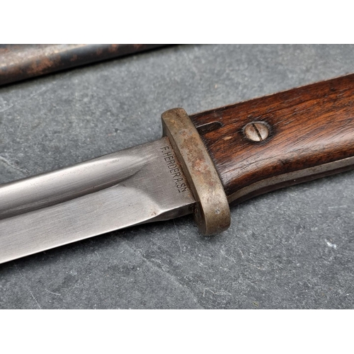 155 - A German WWII Mauser bayonet by F Herderer, stamped '38' and No.8920; together with scabbard by F W ... 