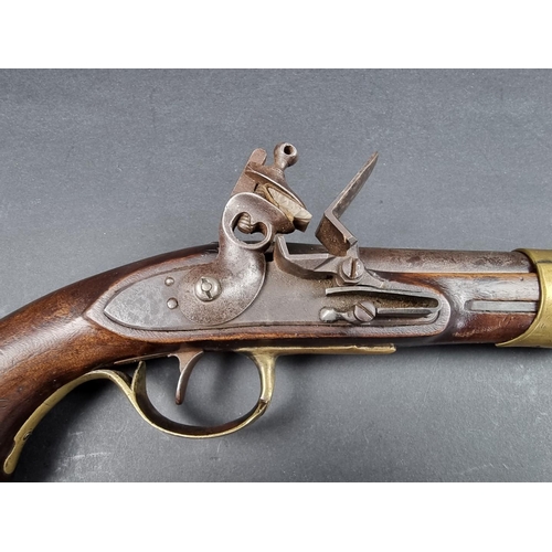 17 - A 19th century military flintlock pistol, with brass fittings and a smooth 4in barrel, probably Cont... 