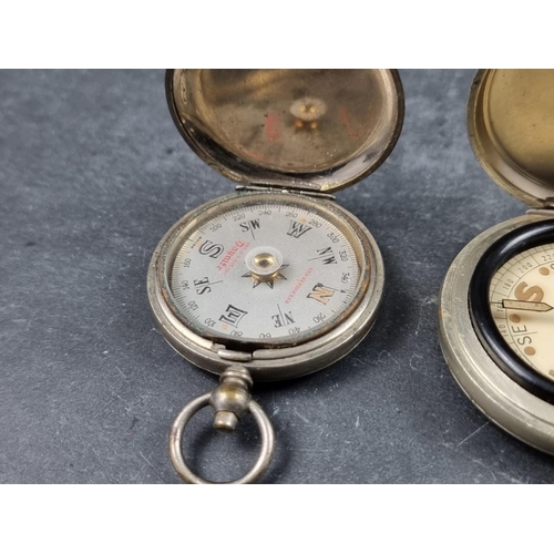 186 - Two WWI military style nickel plated compasses; together with two other pocket compasses. (4)... 