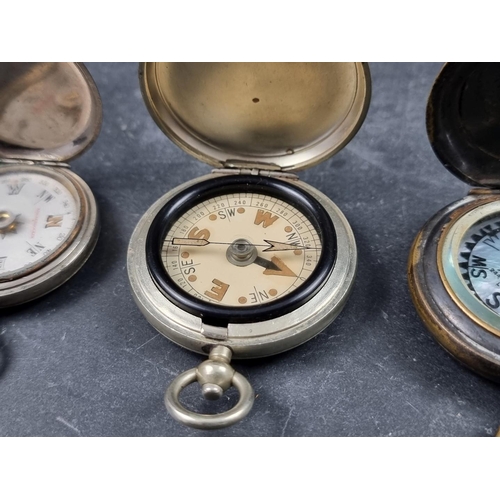 186 - Two WWI military style nickel plated compasses; together with two other pocket compasses. (4)... 