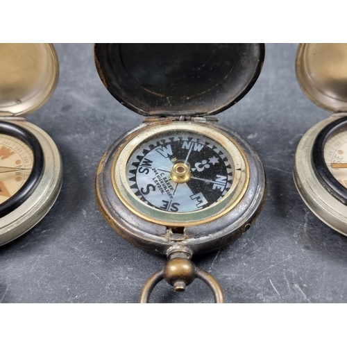 186 - Two WWI military style nickel plated compasses; together with two other pocket compasses. (4)... 