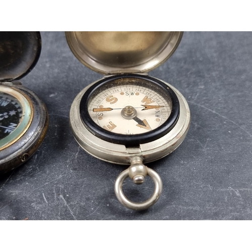 186 - Two WWI military style nickel plated compasses; together with two other pocket compasses. (4)... 