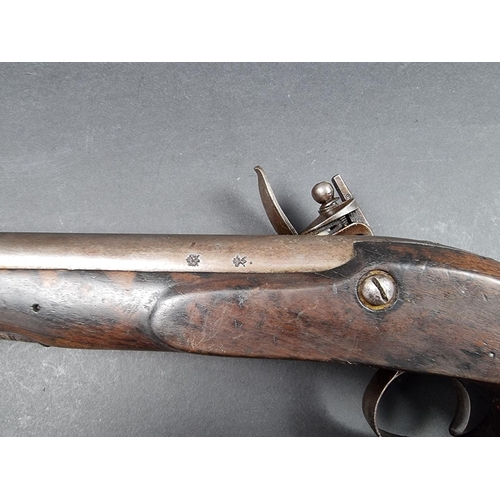 19 - A 19th century flintlock pistol, with smooth bore 7in barrel and engraved lock, London marks.... 