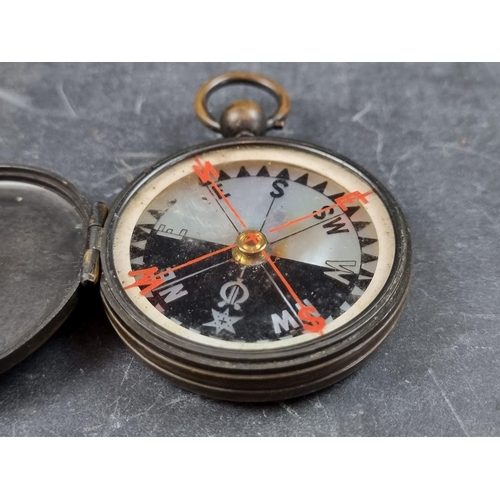 198 - A cased early 20th century brass hunter compass, 62mm.