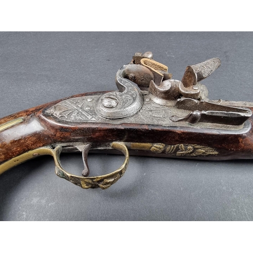 21 - A fine early 19th century Irish duelling pistol, with relief cast 8in barrel and brass fittings, Iri... 