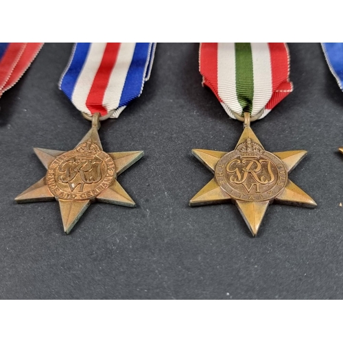 212 - Medals: a WWII group of six, to include: Atlantic Star; Italy Star and Defence Medal.... 