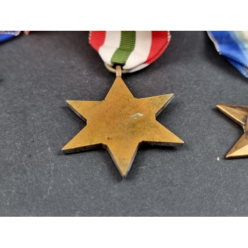 212 - Medals: a WWII group of six, to include: Atlantic Star; Italy Star and Defence Medal.... 