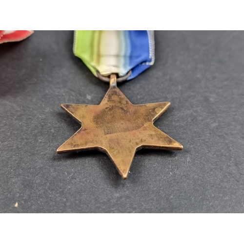 212 - Medals: a WWII group of six, to include: Atlantic Star; Italy Star and Defence Medal.... 