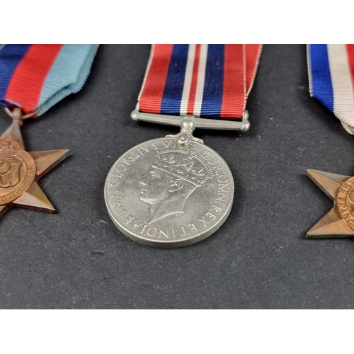 212 - Medals: a WWII group of six, to include: Atlantic Star; Italy Star and Defence Medal.... 