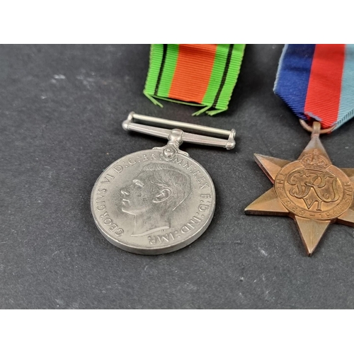 212 - Medals: a WWII group of six, to include: Atlantic Star; Italy Star and Defence Medal.... 