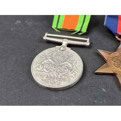 212 - Medals: a WWII group of six, to include: Atlantic Star; Italy Star and Defence Medal.... 