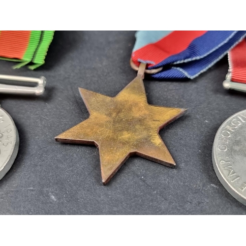 212 - Medals: a WWII group of six, to include: Atlantic Star; Italy Star and Defence Medal.... 