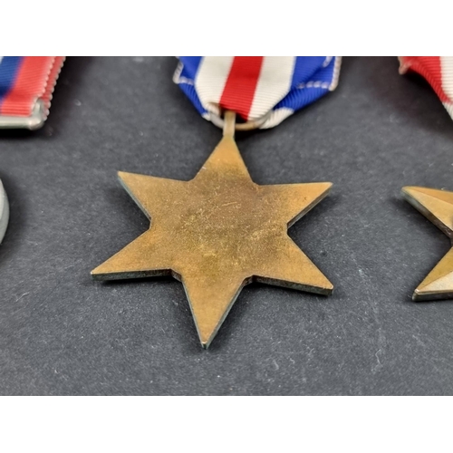 212 - Medals: a WWII group of six, to include: Atlantic Star; Italy Star and Defence Medal.... 