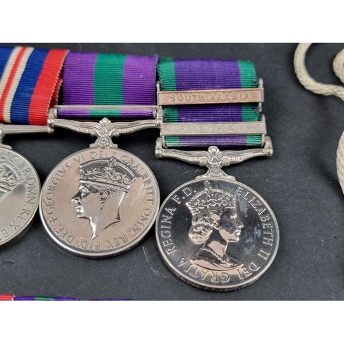 213 - Medals: a group of four, to 54552 Flight Lieutenant F T Dent, R.A.F, comprising: WWII War and Defenc... 