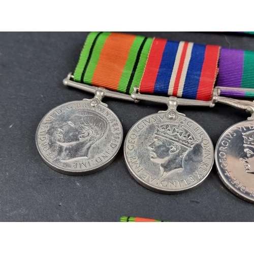 213 - Medals: a group of four, to 54552 Flight Lieutenant F T Dent, R.A.F, comprising: WWII War and Defenc... 