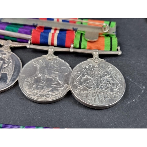 213 - Medals: a group of four, to 54552 Flight Lieutenant F T Dent, R.A.F, comprising: WWII War and Defenc... 