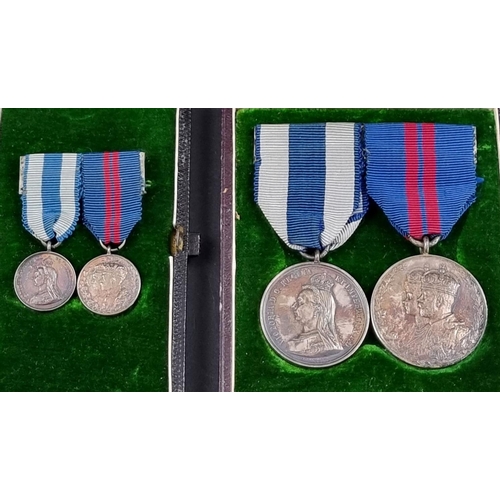 214 - A Victoria 1897 Jubilee Medal; together with a 1911 George V Coronation Medal, cased; and a matching... 