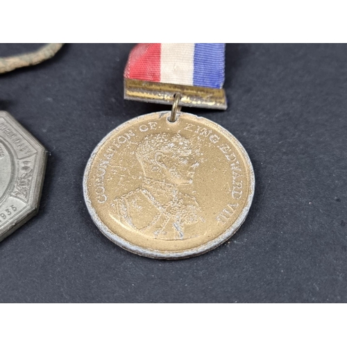 217 - Three Royal Commemorative medals, George V and Edward VII; together with a 17th century alloy shoe b... 