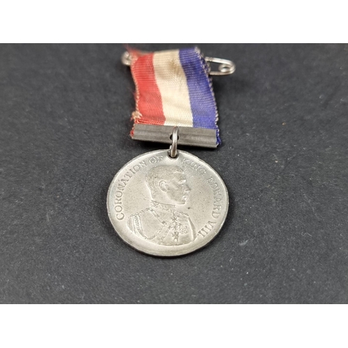 217 - Three Royal Commemorative medals, George V and Edward VII; together with a 17th century alloy shoe b... 