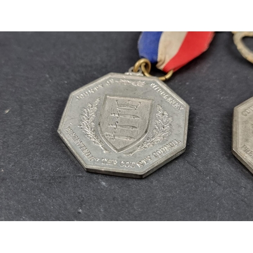 217 - Three Royal Commemorative medals, George V and Edward VII; together with a 17th century alloy shoe b... 