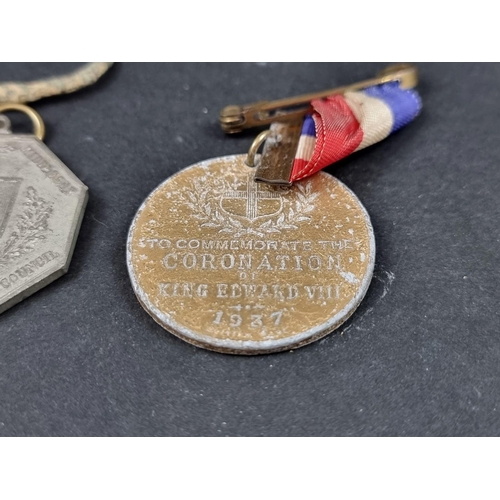 217 - Three Royal Commemorative medals, George V and Edward VII; together with a 17th century alloy shoe b... 