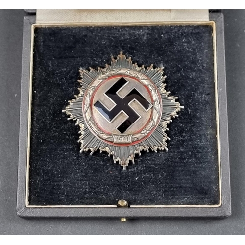 219 - Medals: a good quality reproduction Third Reich German Cross, in silver, boxed.... 