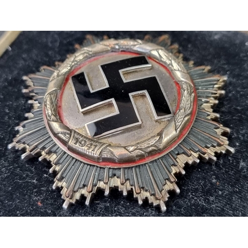 219 - Medals: a good quality reproduction Third Reich German Cross, in silver, boxed.... 