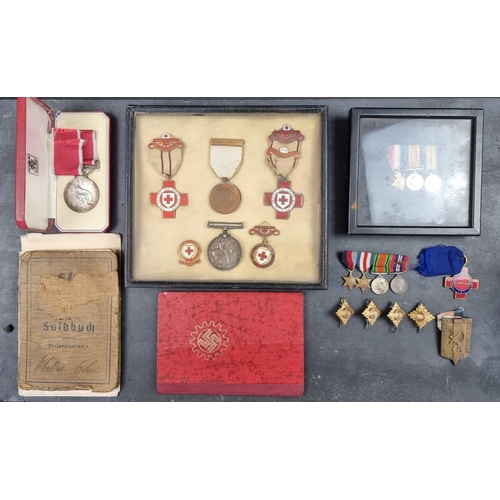 221 - A group of militaria and ephemera, to include; a framed group of five WWI British Red Cross medals, ... 