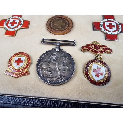 221 - A group of militaria and ephemera, to include; a framed group of five WWI British Red Cross medals, ... 