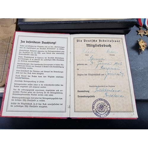 221 - A group of militaria and ephemera, to include; a framed group of five WWI British Red Cross medals, ... 