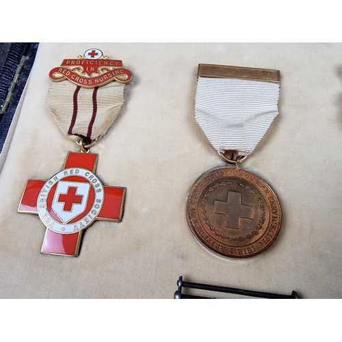 221 - A group of militaria and ephemera, to include; a framed group of five WWI British Red Cross medals, ... 