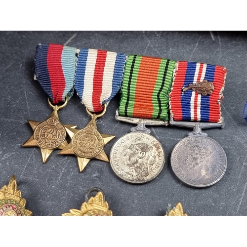 221 - A group of militaria and ephemera, to include; a framed group of five WWI British Red Cross medals, ... 